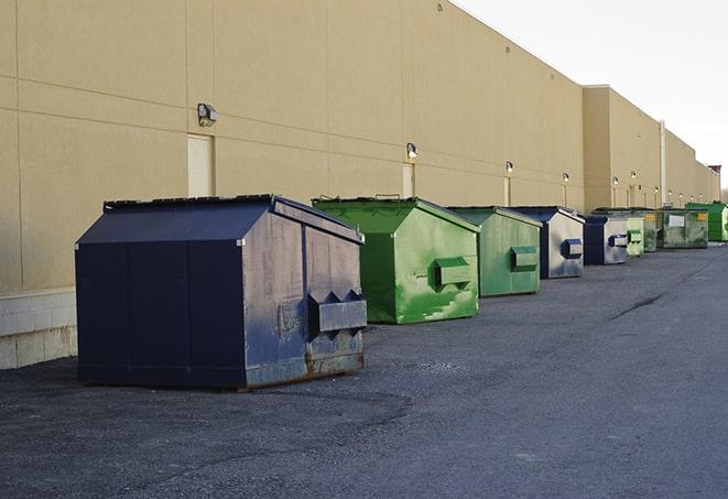 industrial garbage dumpsters filled with discarded materials in Amanda, OH